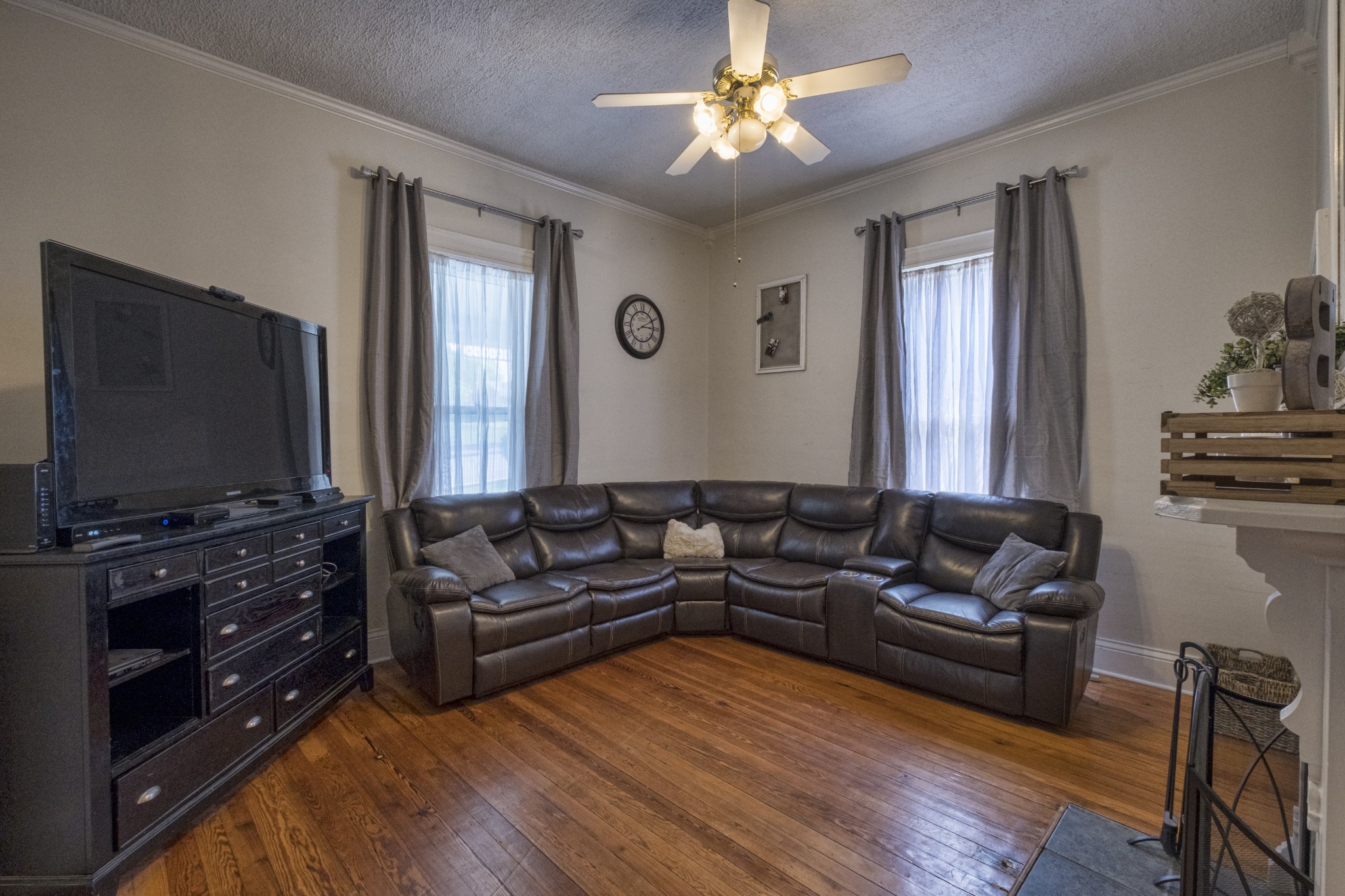 211 North Main Street Springfield, TN 37172 - Photo 21 of 30 a living room with furniture and a flat screen tv