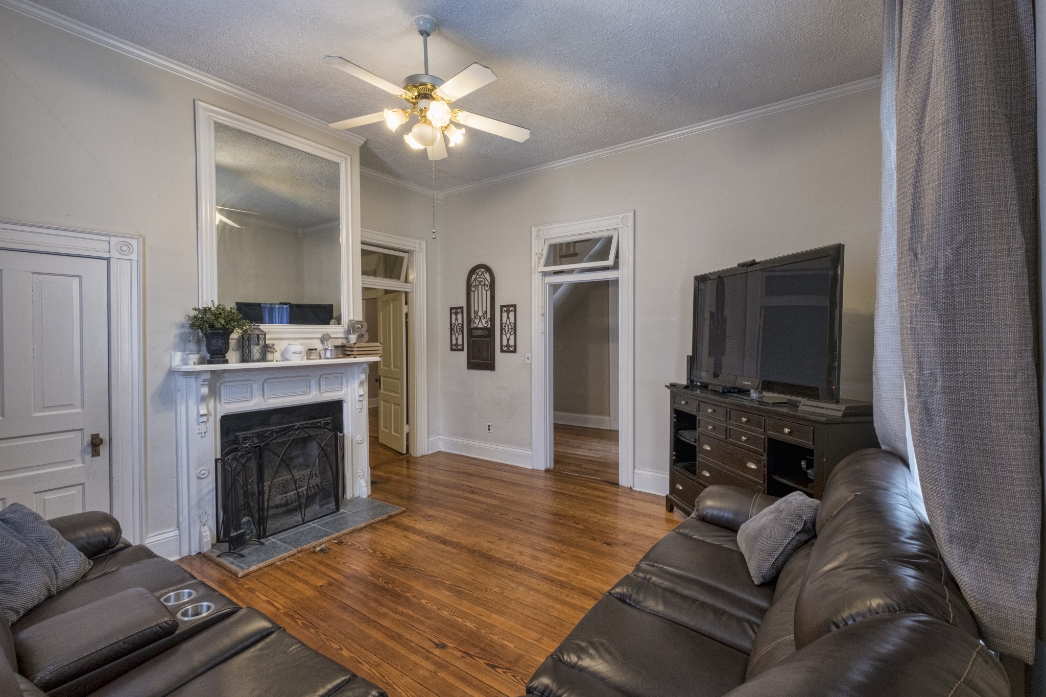 211 North Main Street Springfield, TN 37172 - Photo 22 of 30 a living room with furniture and a fireplace