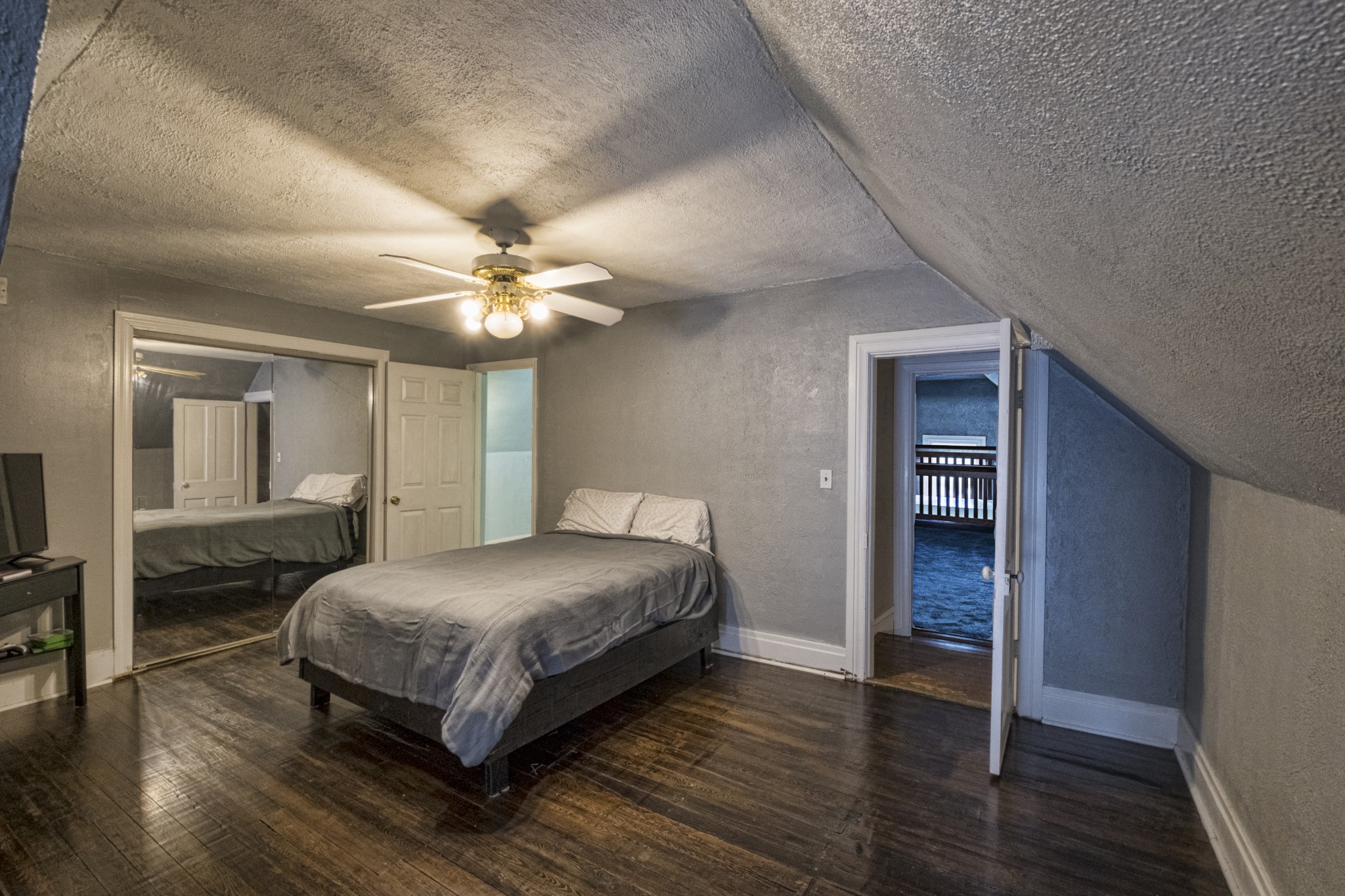 211 North Main Street Springfield, TN 37172 - Photo 27 of 30 a bedroom with a bed and a chandelier