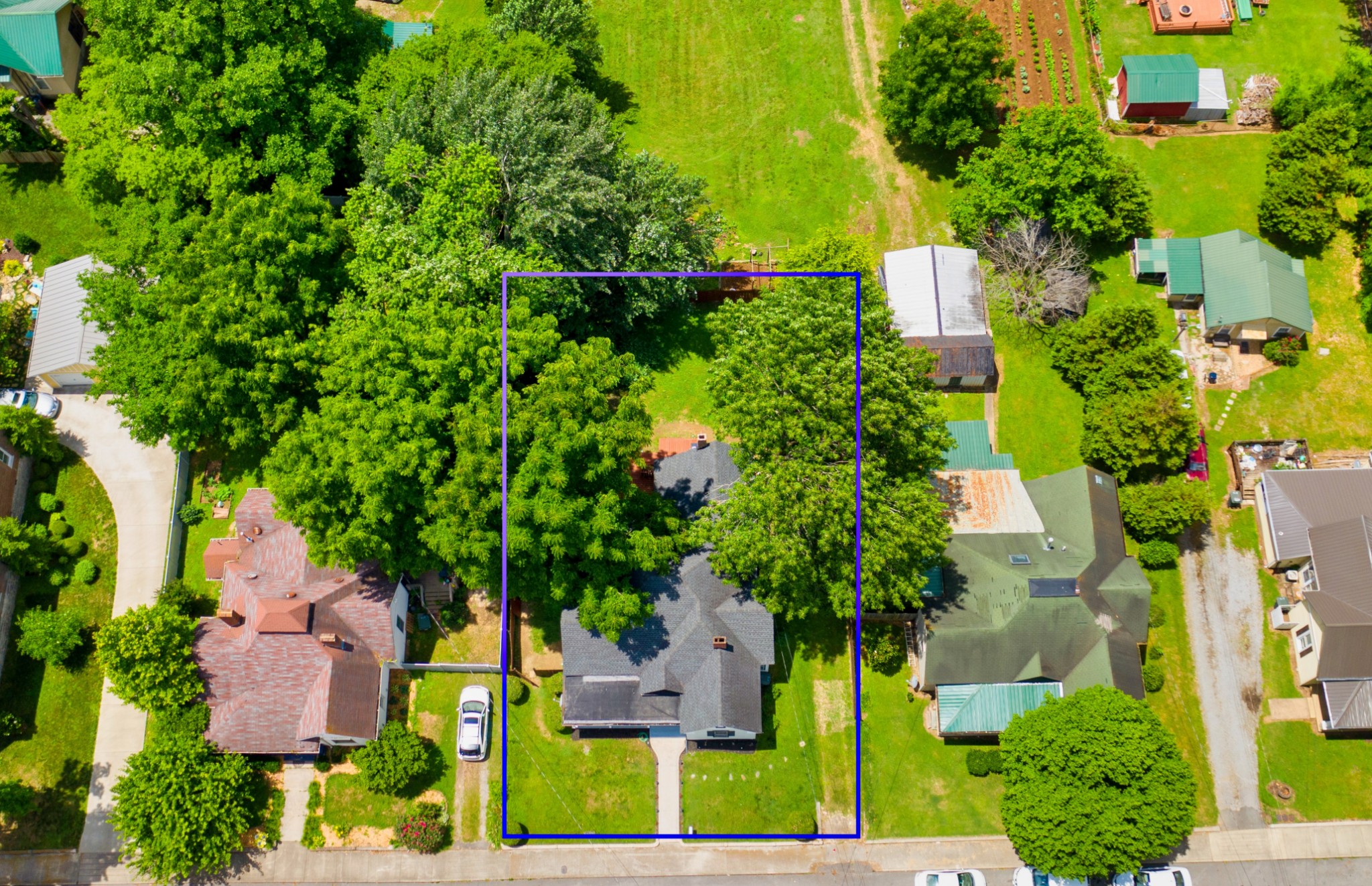 211 North Main Street Springfield, TN 37172 - Photo 3 of 30 an aerial view of residential house with outdoor space and trees all around