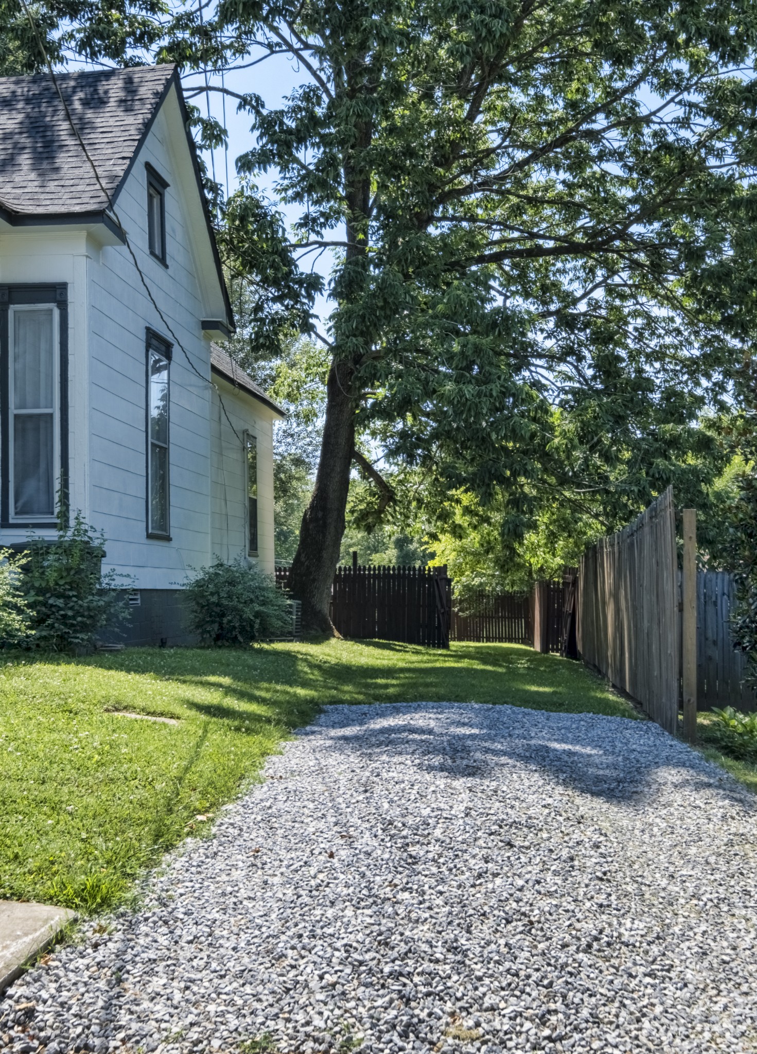 211 North Main Street Springfield, TN 37172 - Photo 4 of 30 a view of a house with a yard and large trees