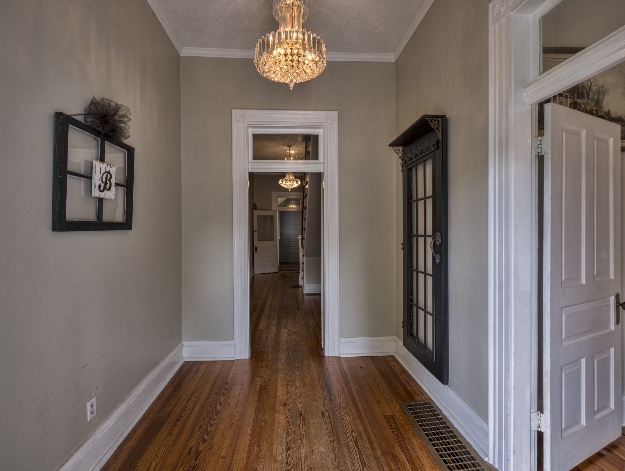 211 North Main Street Springfield, TN 37172 - Photo 5 of 30 a view of a hallway with wooden floor