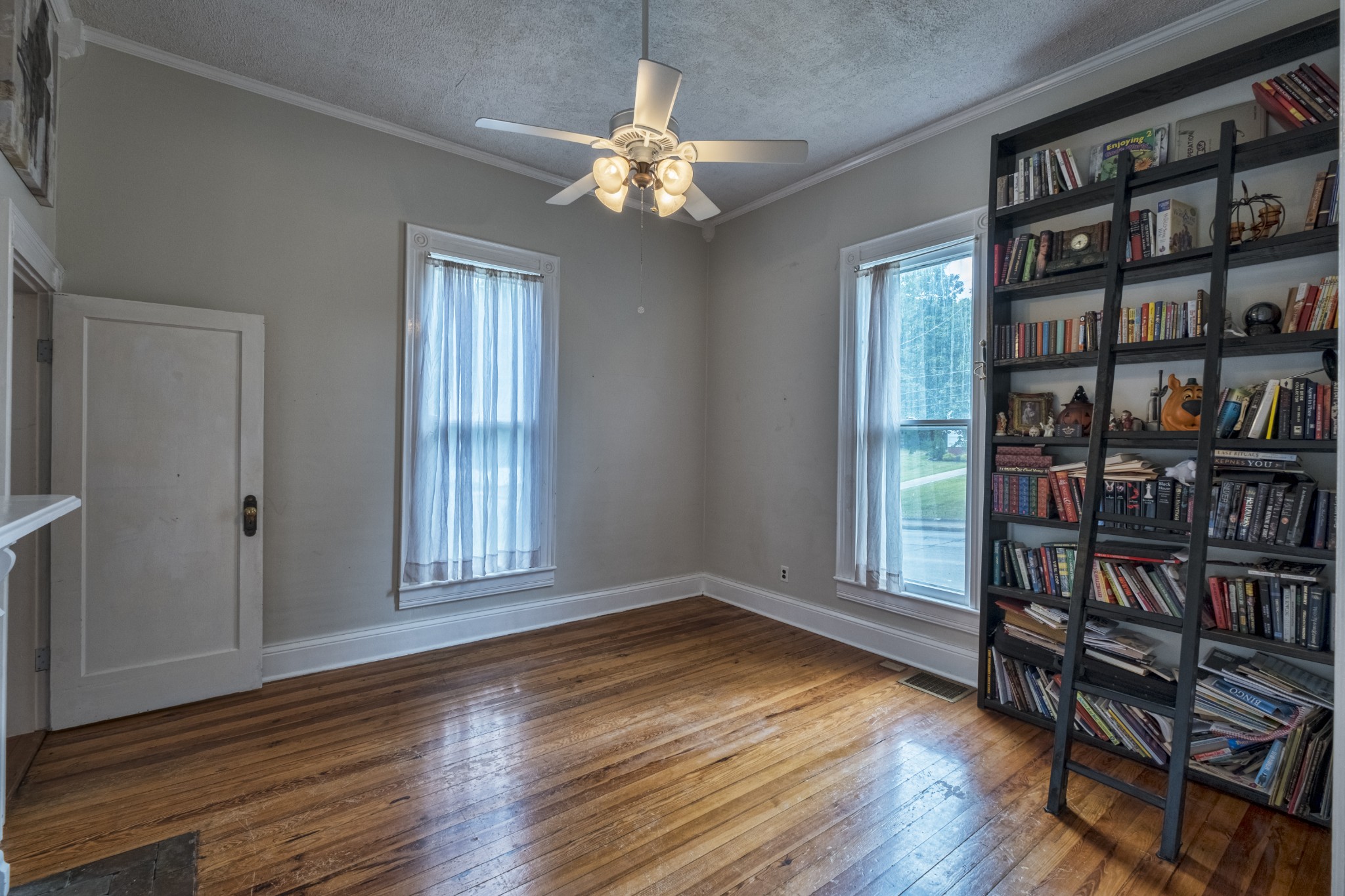 211 North Main Street Springfield, TN 37172 - Photo 9 of 30 a view of an empty room with window and wooden floor