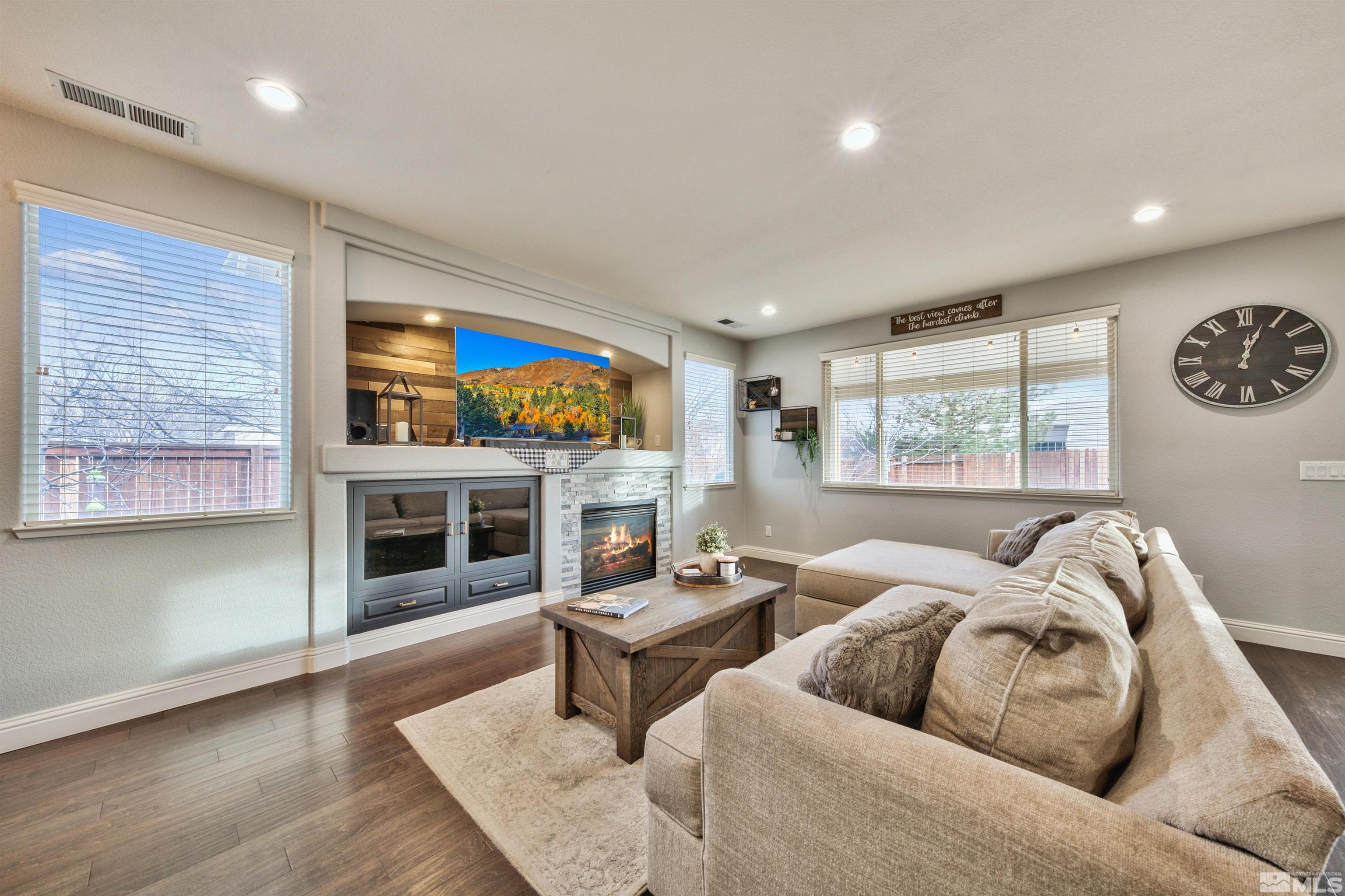 1790 River Gorge Drive Reno, NV 89521 - Photo 6 of 28 a living room with furniture a fireplace and a flat screen tv