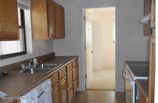 5919 Ridgeway Road East Jacksonville, FL 32244 - Photo 5 of 14 a bathroom with a granite countertop sink and a mirror