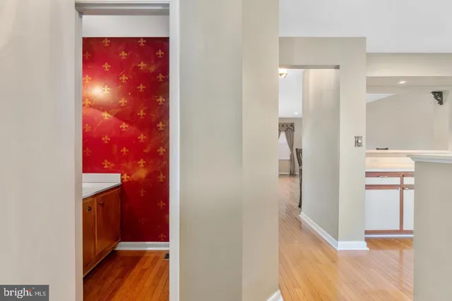 a view of a bathroom from a hallway