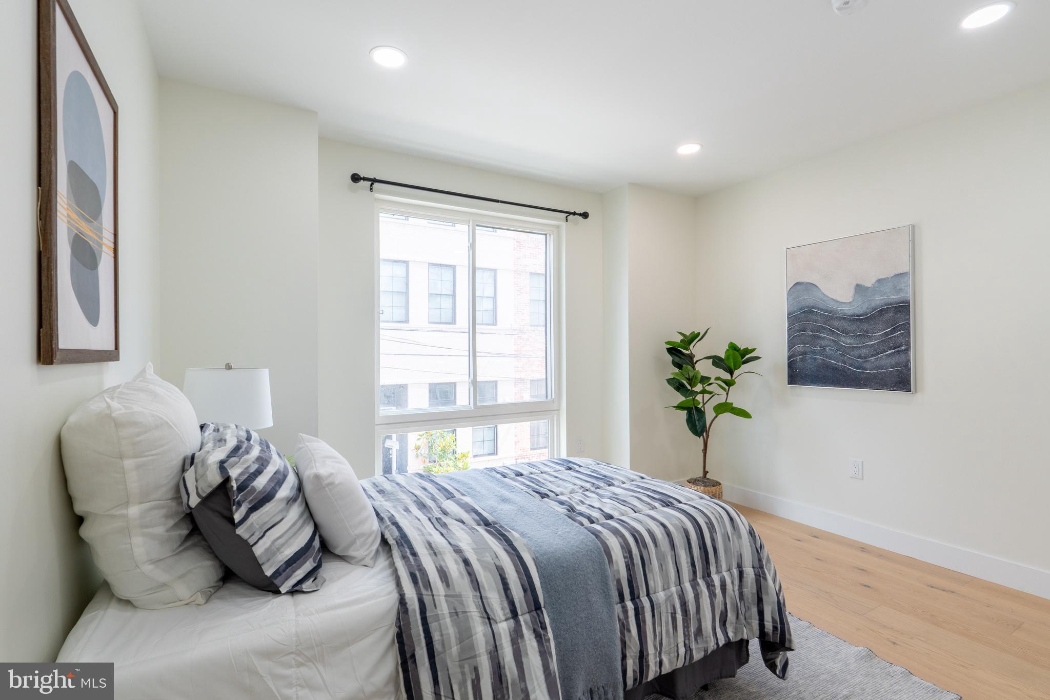 622 McClellan Street Philadelphia, PA 19148 - Photo 22 of 52 a bedroom with a bed and a window