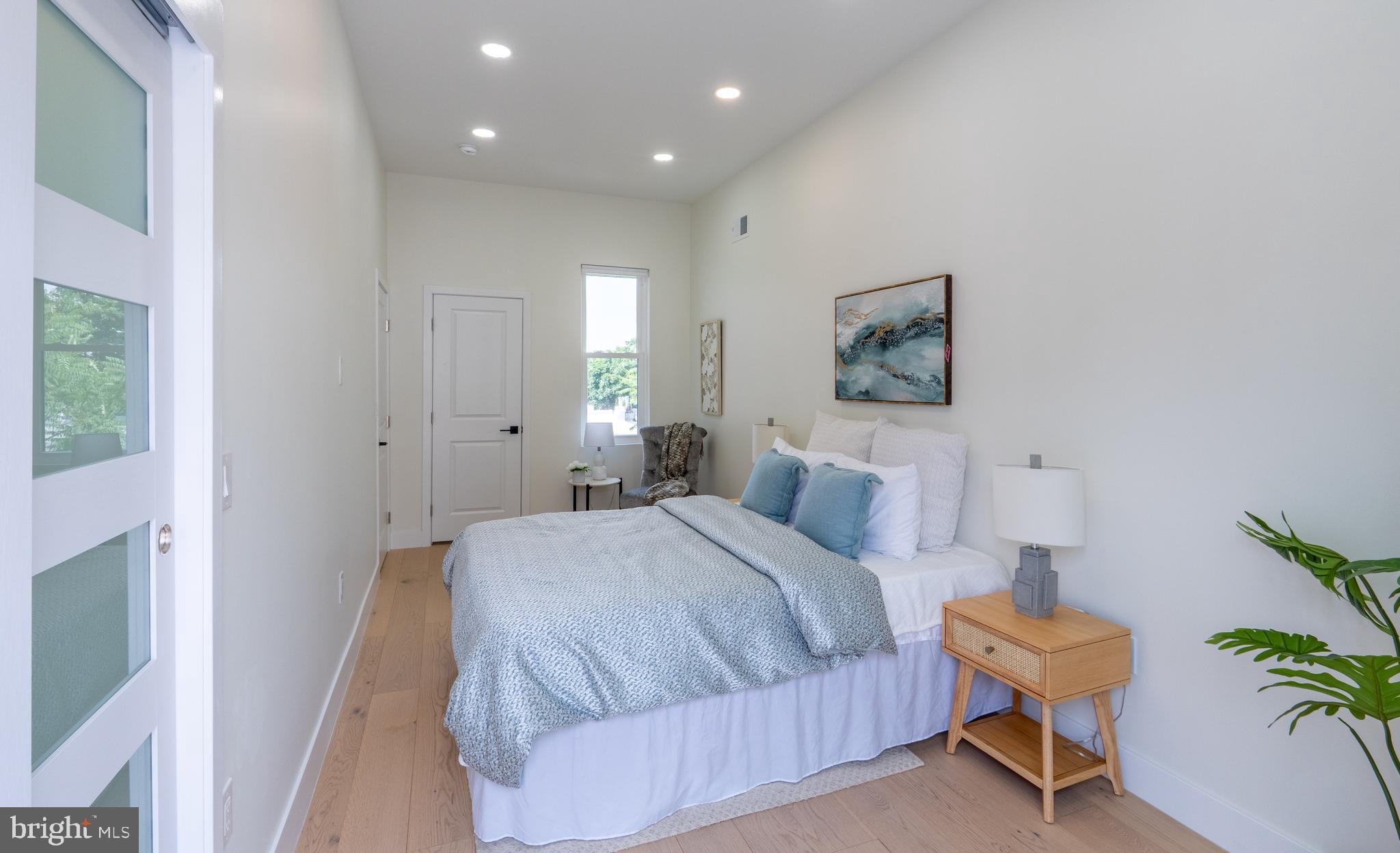 622 McClellan Street Philadelphia, PA 19148 - Photo 31 of 52 a bedroom with a bed and painting on the wall
