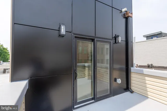 a bathroom with a shower and a sink