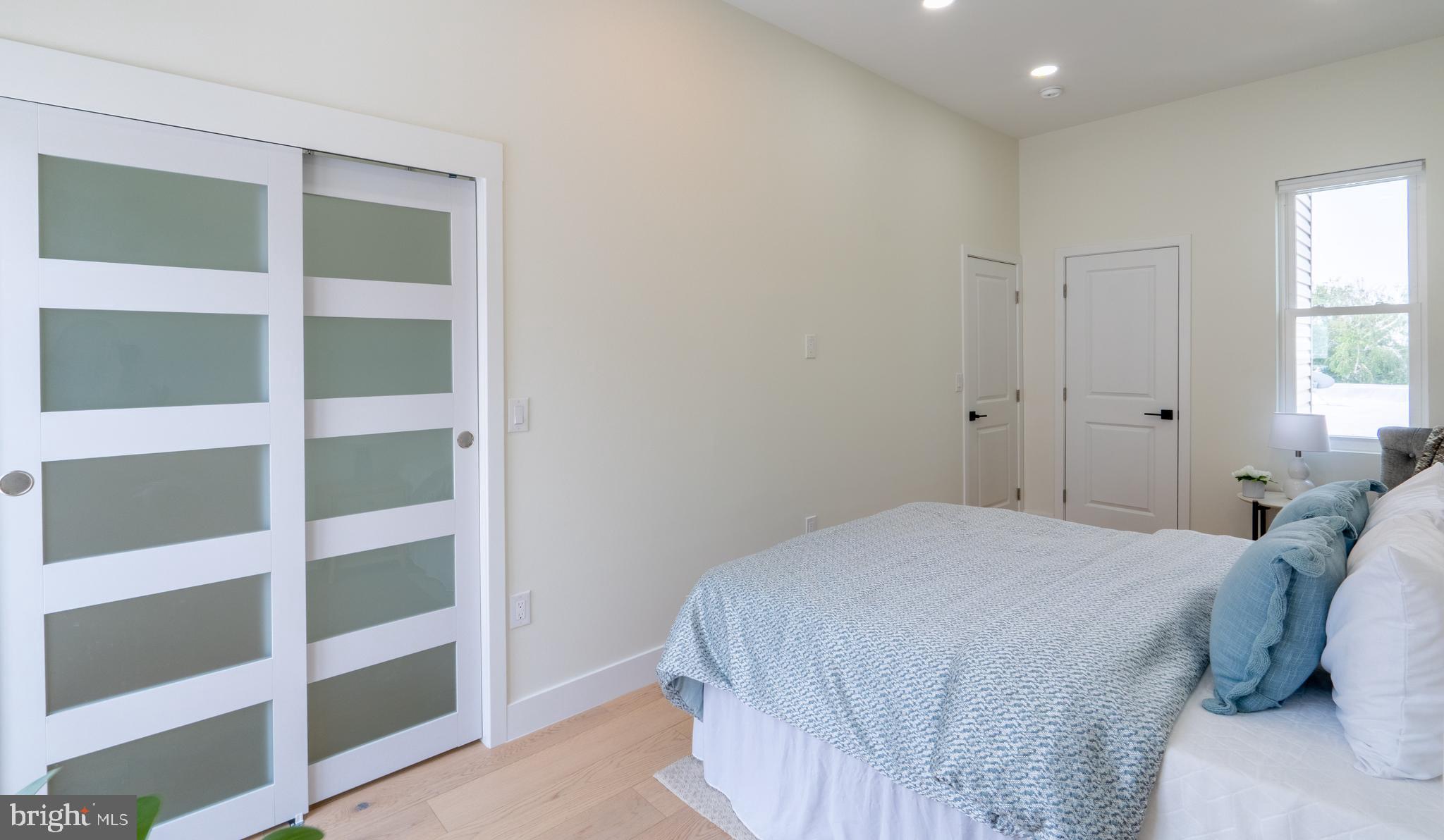 622 McClellan Street Philadelphia, PA 19148 - Photo 35 of 52 a bedroom with a bed and a window