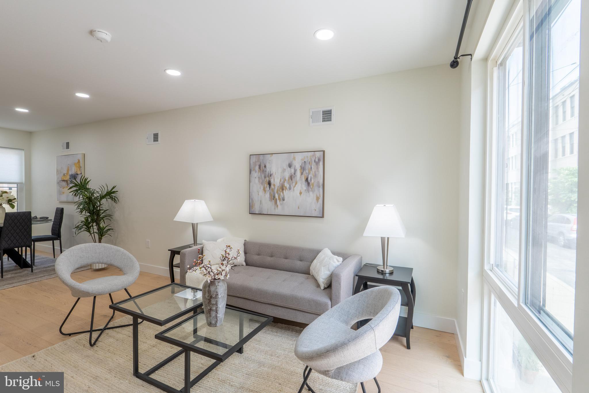 622 McClellan Street Philadelphia, PA 19148 - Photo 4 of 52 a living room with furniture and a large window