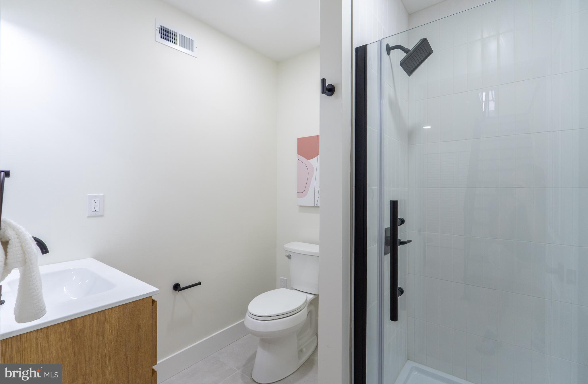 622 McClellan Street Philadelphia, PA 19148 - Photo 46 of 52 a bathroom with a sink and toilet