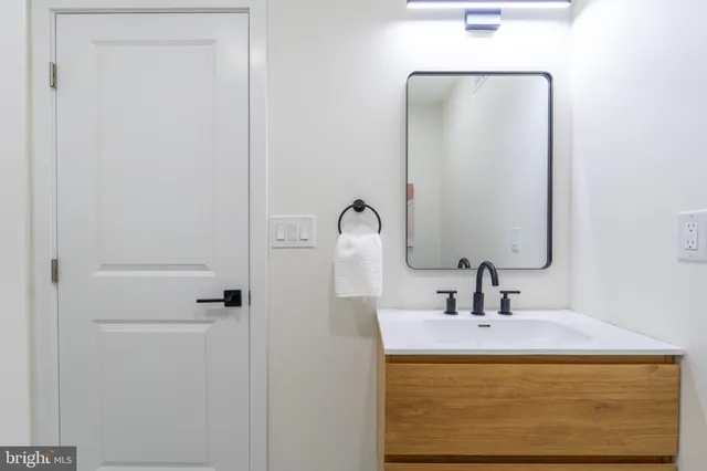 a view of house with chair and wooden floor