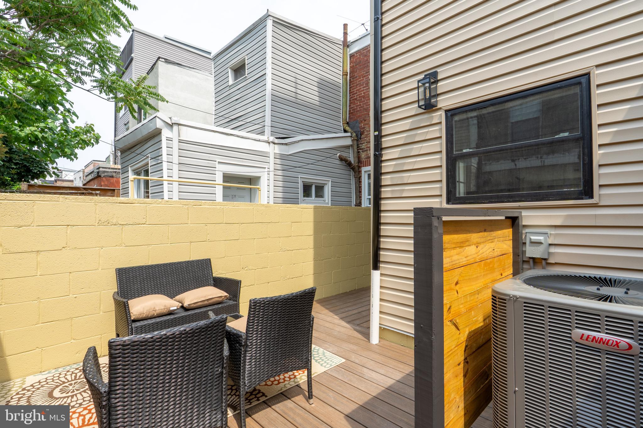 622 McClellan Street Philadelphia, PA 19148 - Photo 50 of 52 a view of house with chair and wooden floor