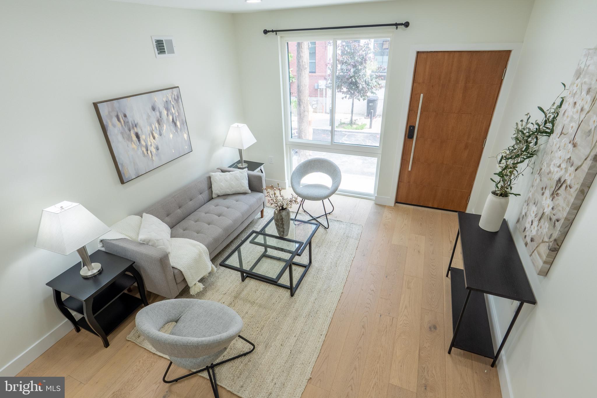 622 McClellan Street Philadelphia, PA 19148 - Photo 9 of 52 a living room with furniture and a window