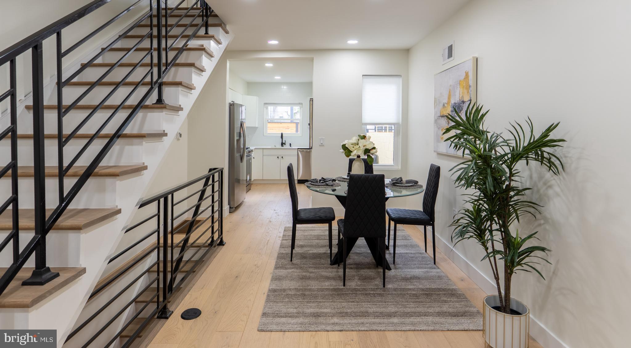 622 McClellan Street Philadelphia, PA 19148 - Photo 10 of 52 a view of a dining room with furniture and a potted plant