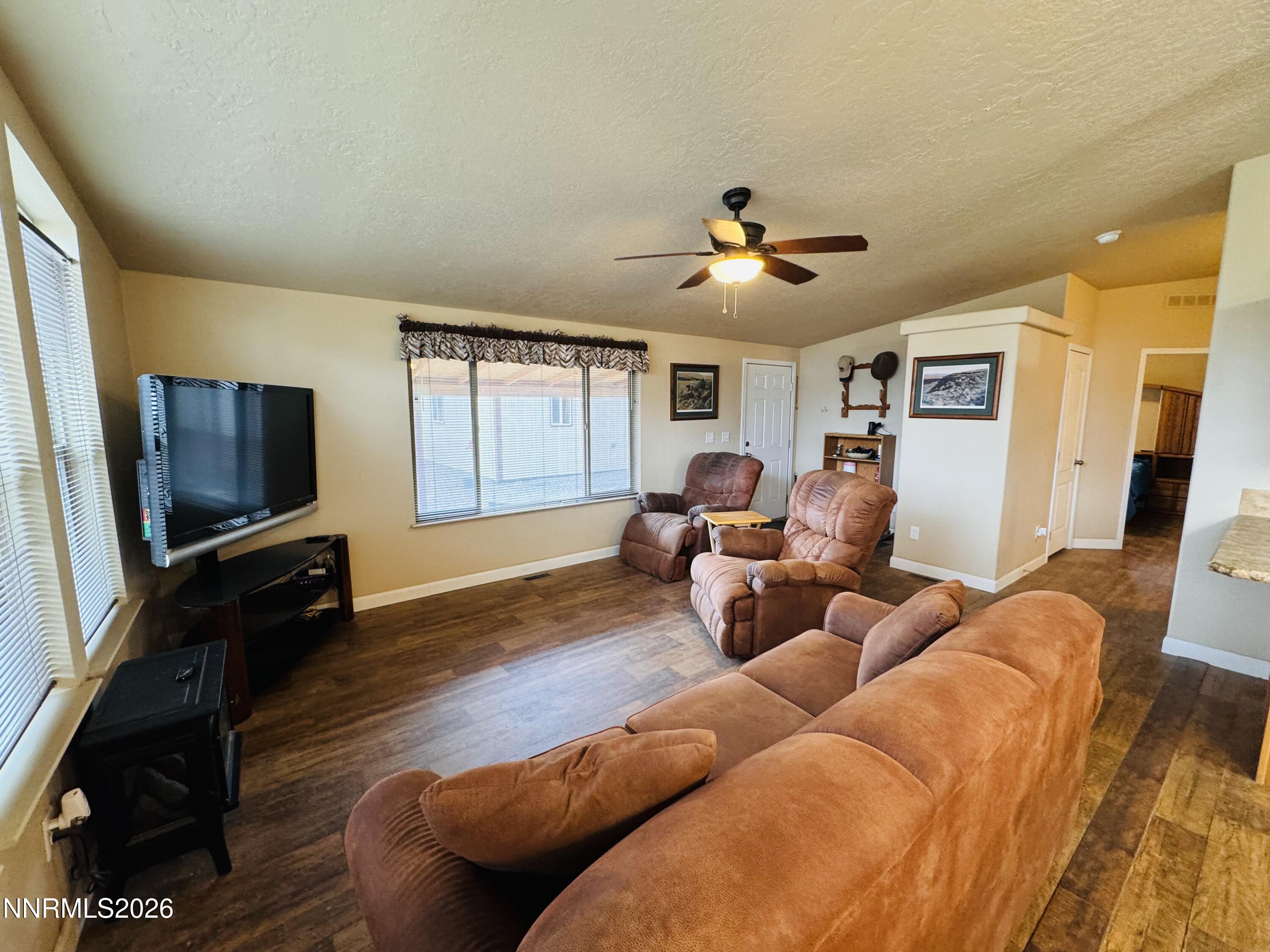 29400 Kings River Road Orovada, NV 89425 - Photo 11 of 40 a living room with furniture flat screen tv and wooden floor