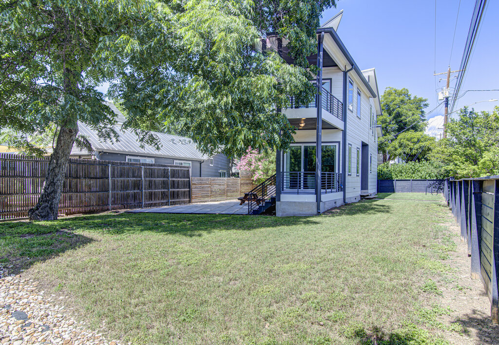 2406 East 16th Street Austin, TX 78702 - Photo 2 of 39 a view of a house with a backyard and porch