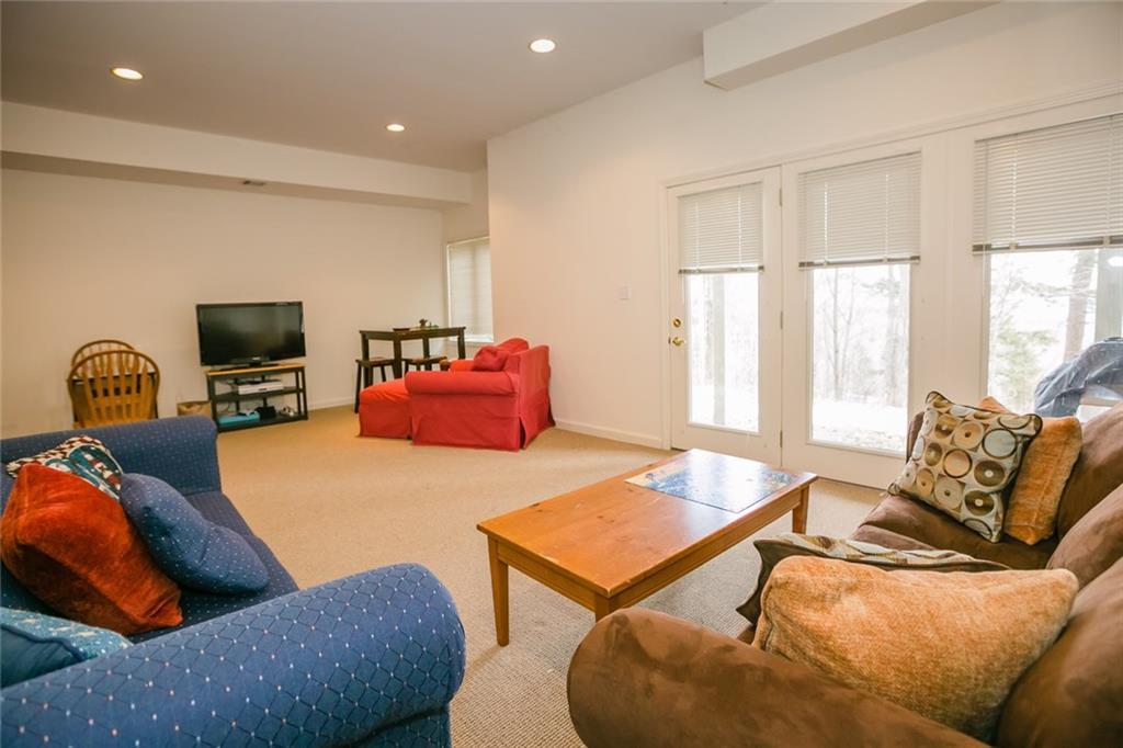 96 Locke Village Road, Unit I2 Newry, ME 04261 - Photo 23 of 34 Family Room in daylight basement