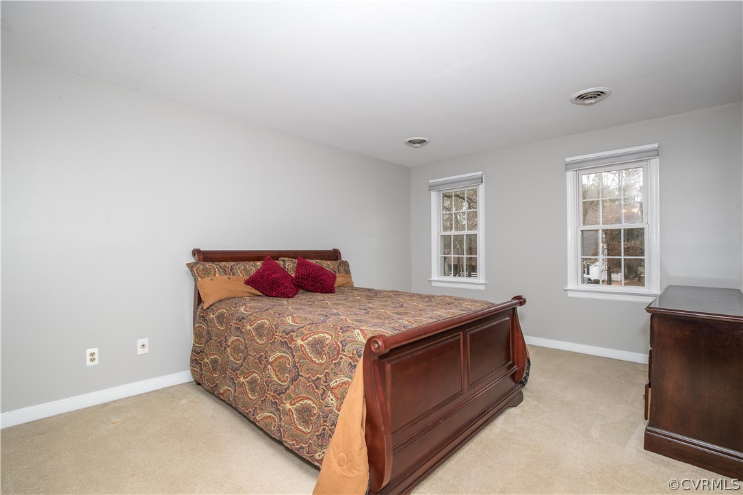 3003 Sagegrove Road Midlothian, VA 23112 - Photo 15 of 22 a bed sitting in a bedroom next to a window