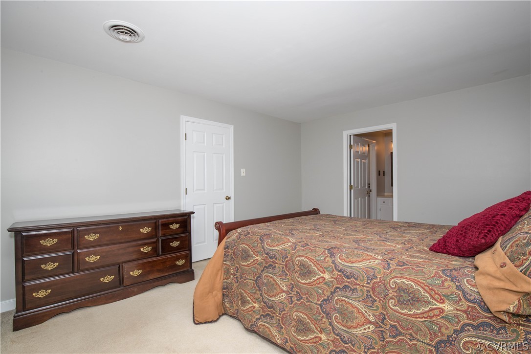 3003 Sagegrove Road Midlothian, VA 23112 - Photo 16 of 22 a bedroom with a bed and a dresser