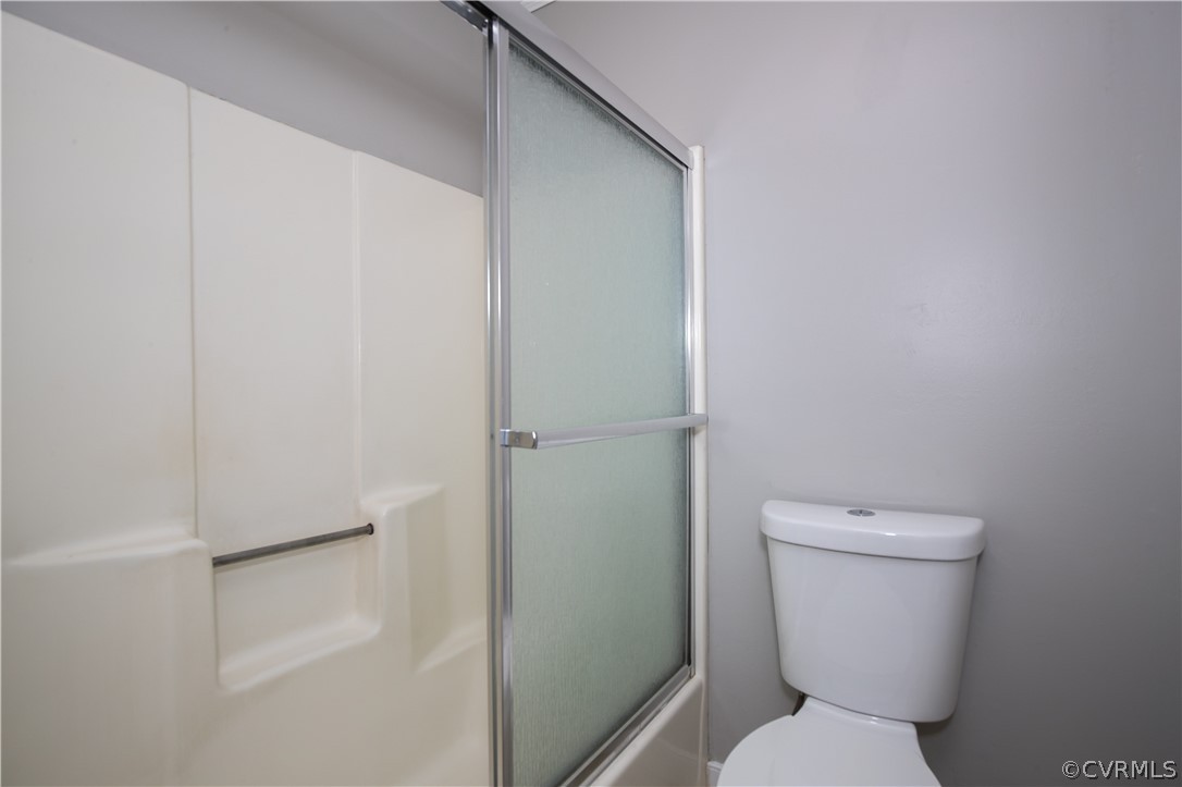 3003 Sagegrove Road Midlothian, VA 23112 - Photo 18 of 22 a white toilet sitting next to a white cabinet