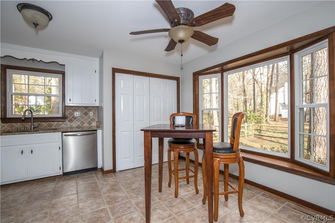 3003 Sagegrove Road Midlothian, VA 23112 - Photo 6 of 22 a kitchen with a table chairs sink and cabinets