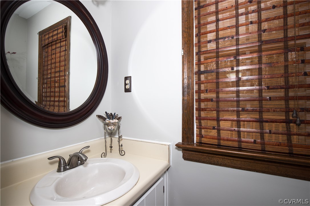 3003 Sagegrove Road Midlothian, VA 23112 - Photo 10 of 22 a bathroom with a sink and a mirror