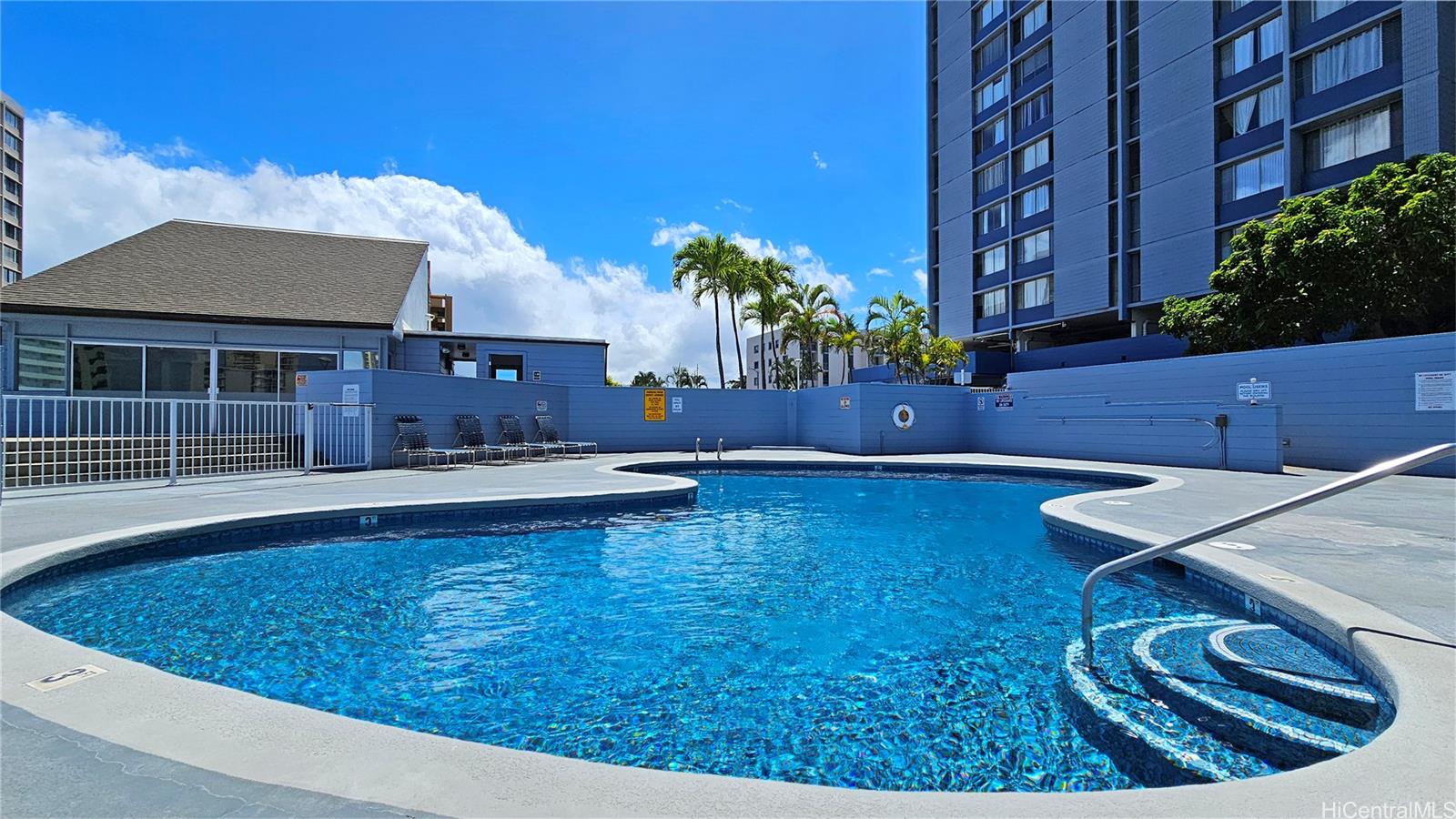 3045 Ala Napuaa Place, Unit 1613 Honolulu, HI 96818 - Photo 14 of 20 a view of a house with pool and a yard