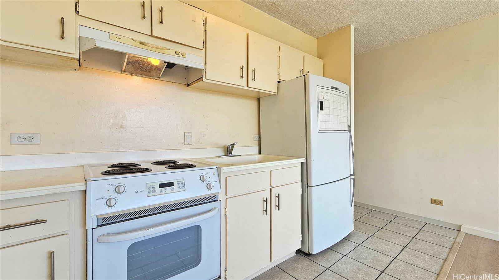 3045 Ala Napuaa Place, Unit 1613 Honolulu, HI 96818 - Photo 8 of 20 a kitchen with cabinets and steel stainless steel appliances