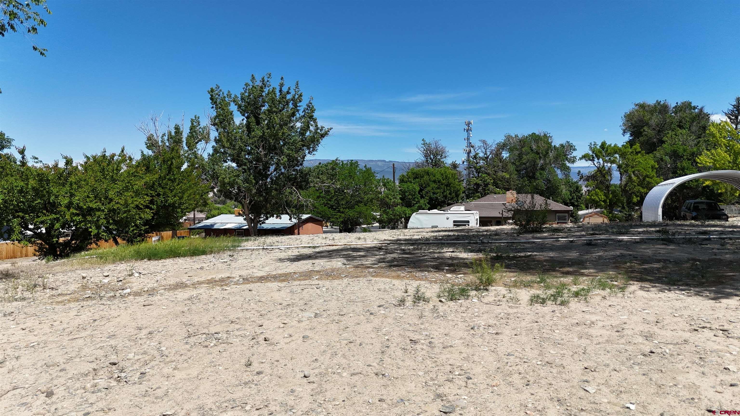 Tbd East 7th Street Delta, CO 81416 - Photo 2 of 8 a view of a yard with plants and trees