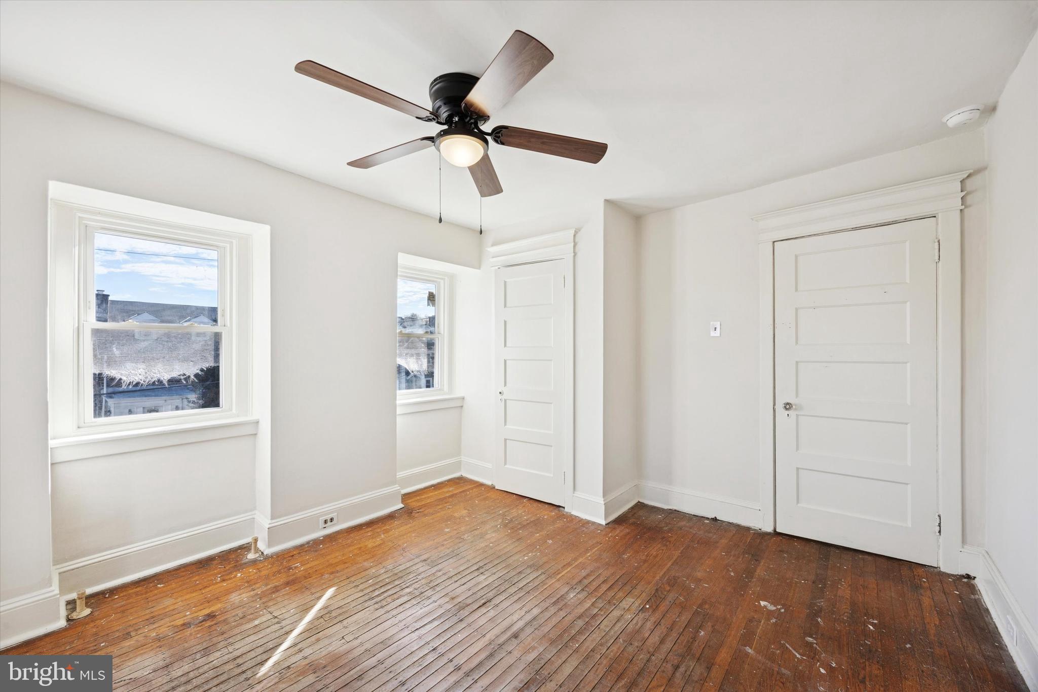 46 Copley Road Upper Darby, PA 19082 - Photo 12 of 21 a view of an empty room with wooden floor and a window