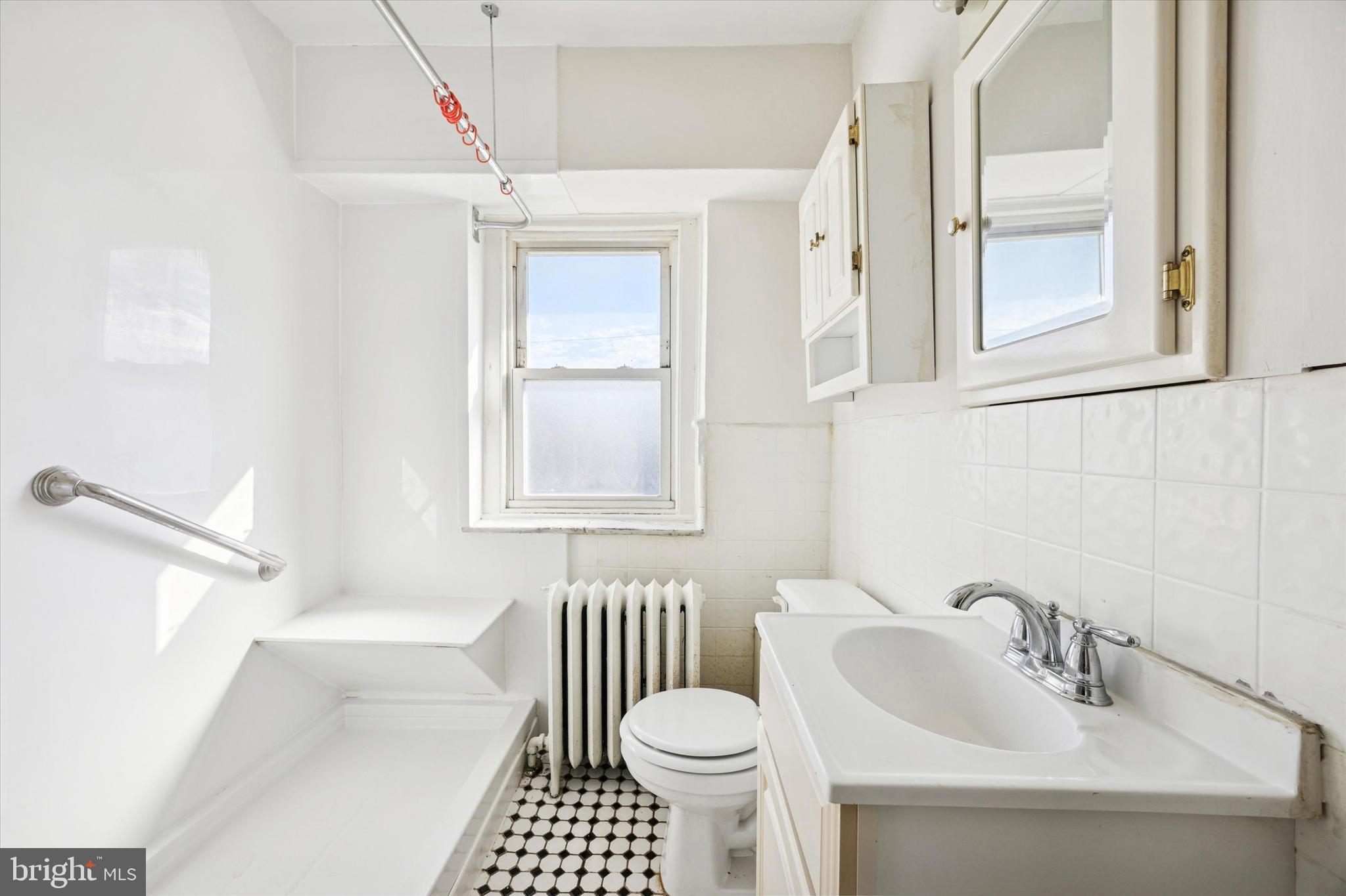 46 Copley Road Upper Darby, PA 19082 - Photo 13 of 21 a bathroom with a sink toilet and shower