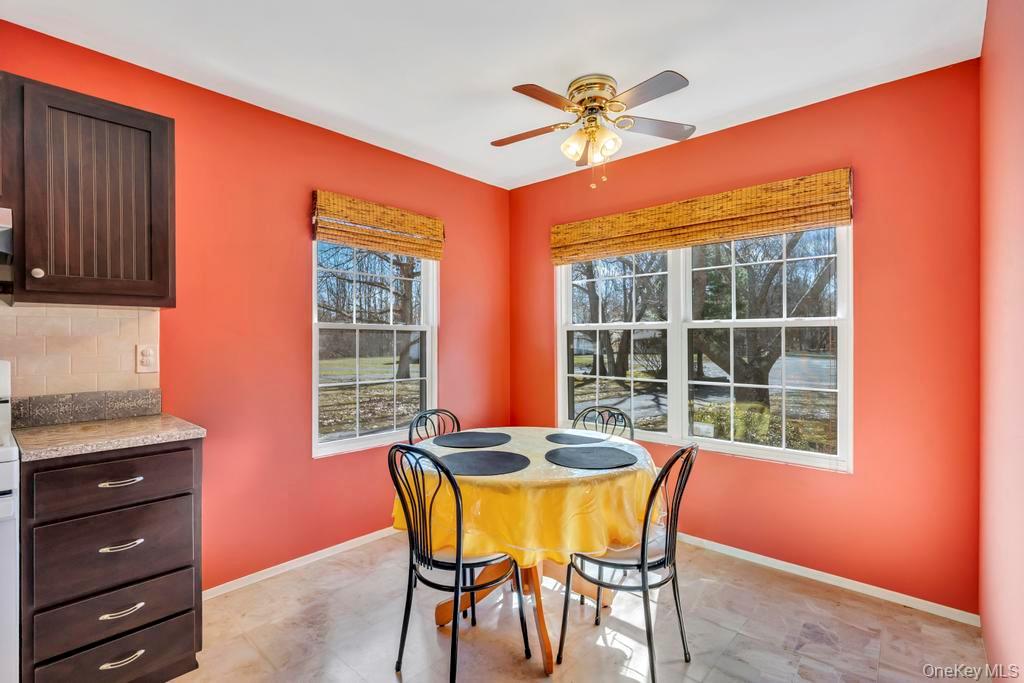 13 Mallard Path Coram, NY 11727 - Photo 11 of 39 a dining room with furniture and window