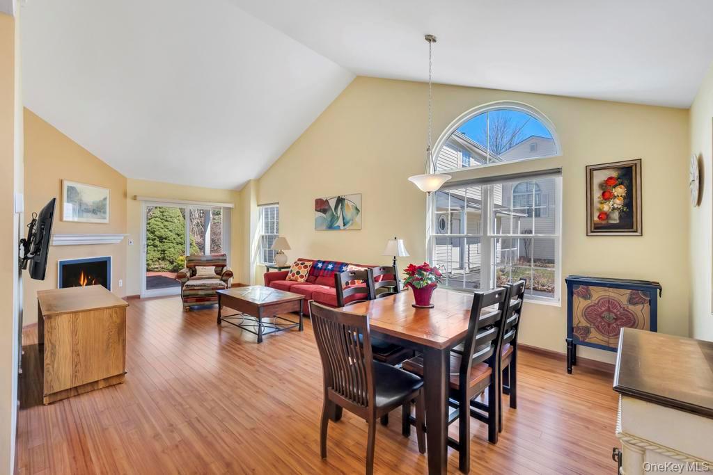 13 Mallard Path Coram, NY 11727 - Photo 13 of 39 a view of a dining room with furniture window and wooden floor