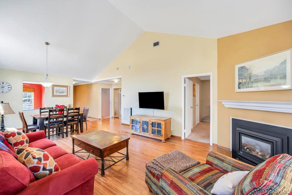 13 Mallard Path Coram, NY 11727 - Photo 15 of 39 a living room with furniture and a flat screen tv