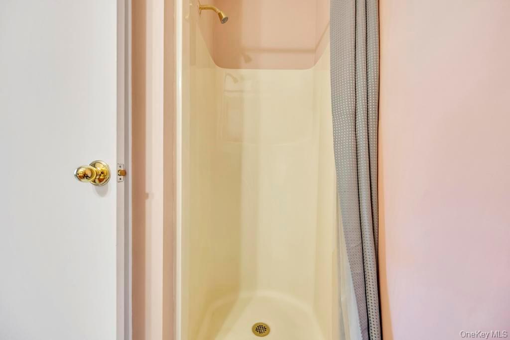 13 Mallard Path Coram, NY 11727 - Photo 21 of 39 a bathroom with a shower
