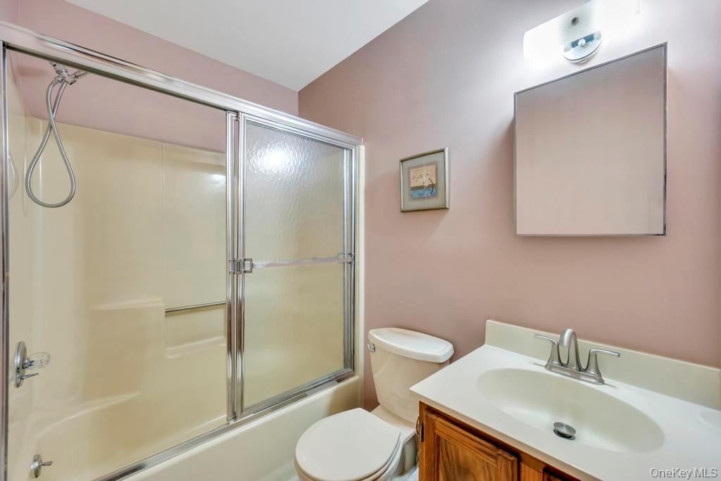 13 Mallard Path Coram, NY 11727 - Photo 24 of 39 a bathroom with a sink toilet and shower