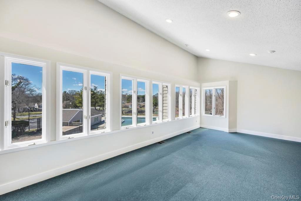 13 Mallard Path Coram, NY 11727 - Photo 29 of 39 a view of an empty room with a window