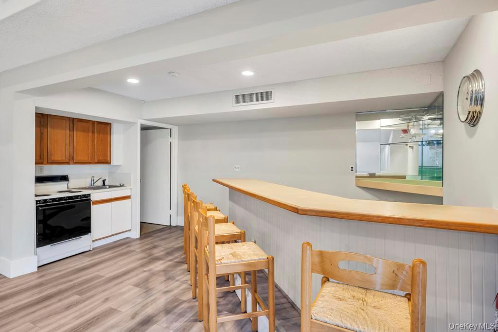 13 Mallard Path Coram, NY 11727 - Photo 31 of 39 a kitchen with a table and chairs in it