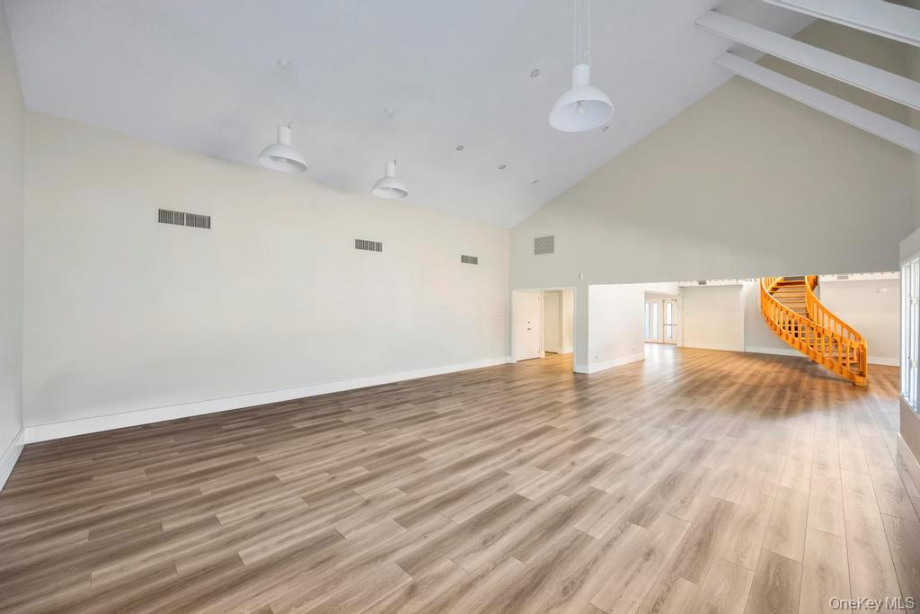 13 Mallard Path Coram, NY 11727 - Photo 34 of 39 a view of empty room with wooden floor and fan