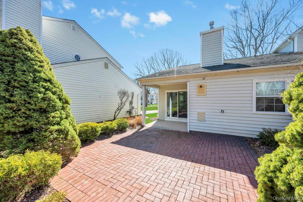 13 Mallard Path Coram, NY 11727 - Photo 4 of 39 a view of a back yard of the house