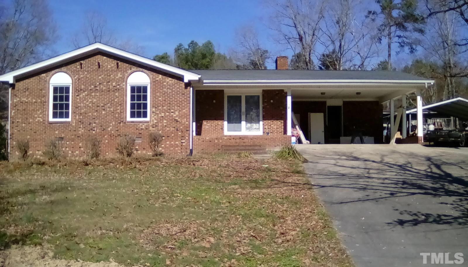 115 Kerr Lake Club Road Henderson, NC 27537 - Photo 1 of 20 front view of a house with a yard