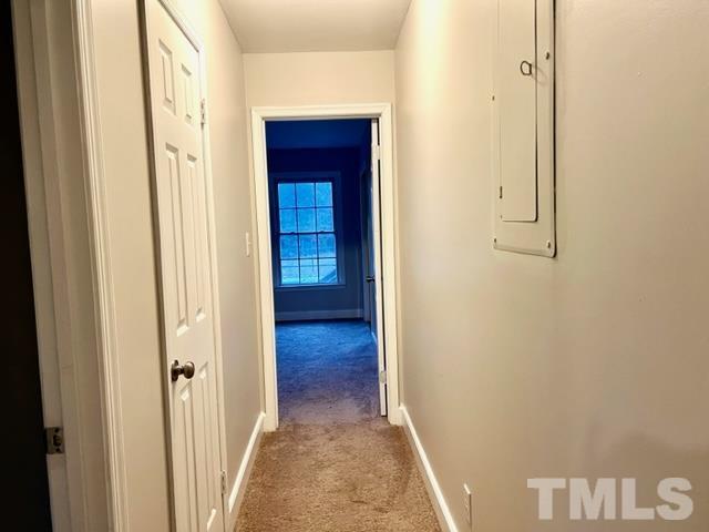 115 Kerr Lake Club Road Henderson, NC 27537 - Photo 11 of 20 a view of a hallway with wooden floor