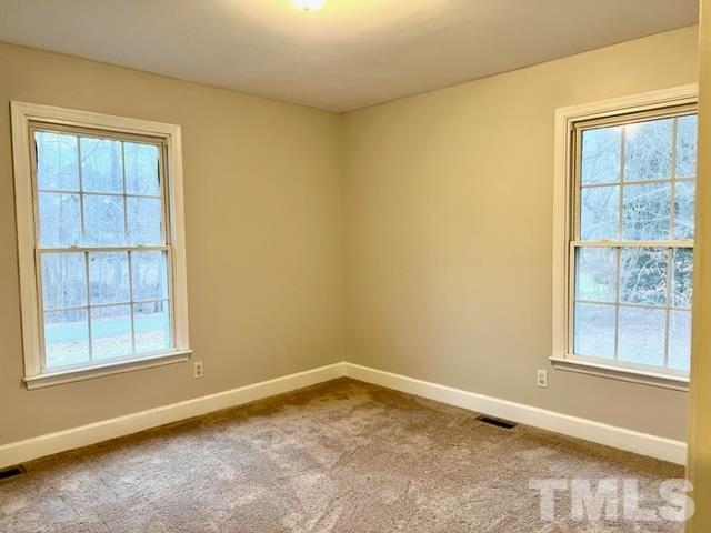 115 Kerr Lake Club Road Henderson, NC 27537 - Photo 12 of 20 an empty room with windows