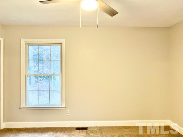 115 Kerr Lake Club Road Henderson, NC 27537 - Photo 16 of 20 a view of wooden floor and windows in a room