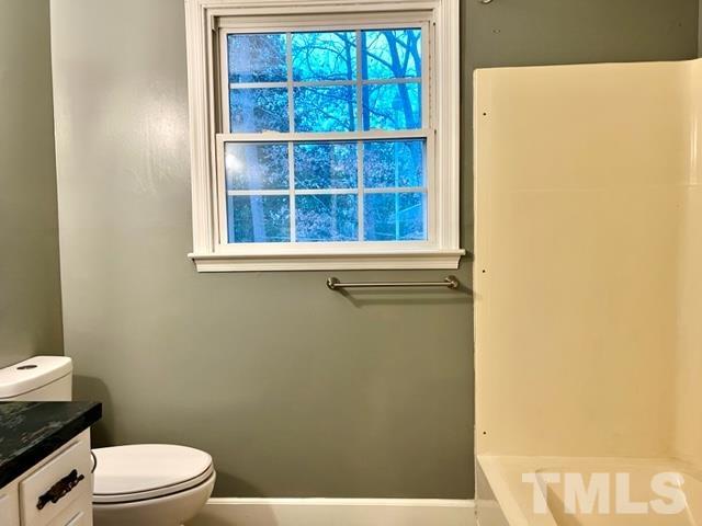 115 Kerr Lake Club Road Henderson, NC 27537 - Photo 17 of 20 a white toilet sitting next to a window