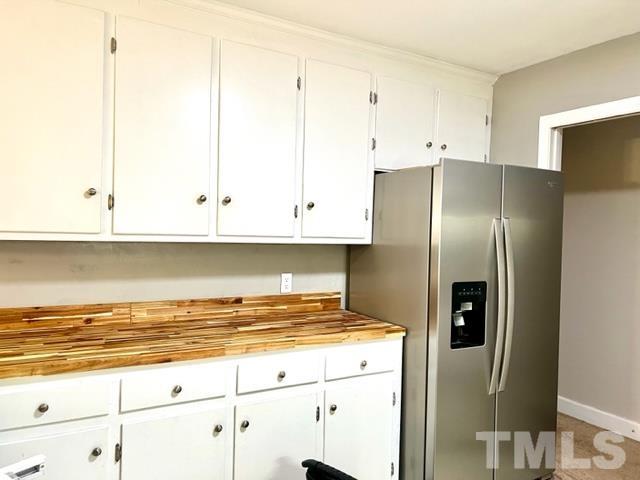 115 Kerr Lake Club Road Henderson, NC 27537 - Photo 5 of 20 a kitchen with stainless steel appliances granite countertop a refrigerator and a stove