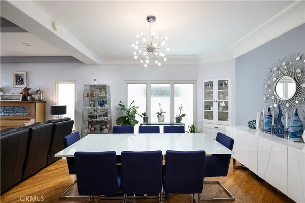 a view of a dining room with furniture and a flat screen tv