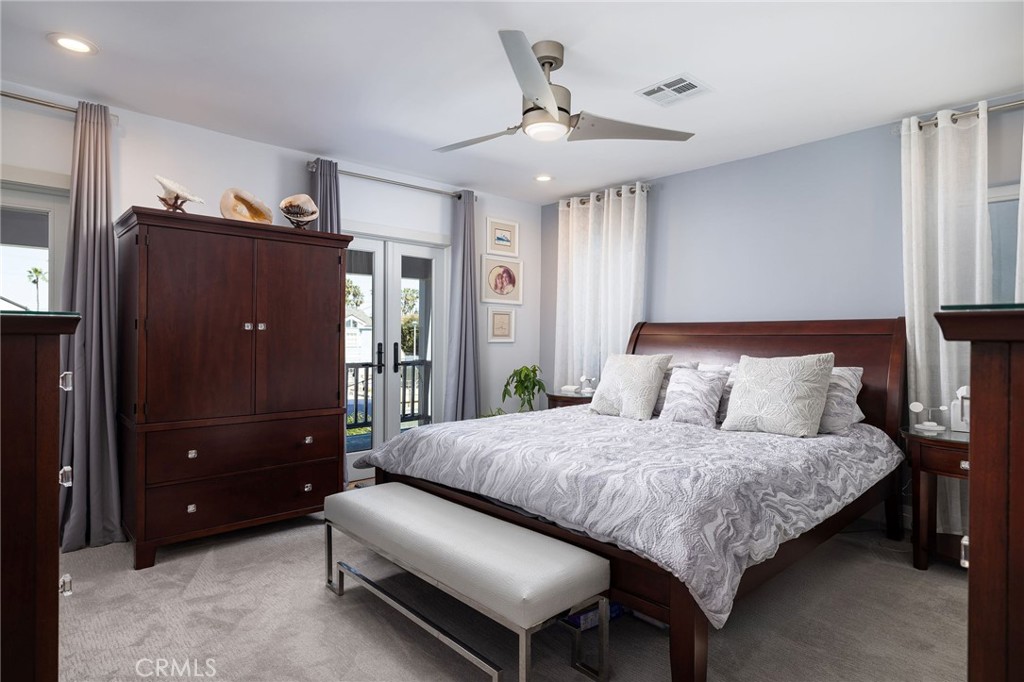 90 Rivo Alto Canal Long Beach, CA 90803 - Photo 22 of 52 a bedroom with a bed and a chandelier